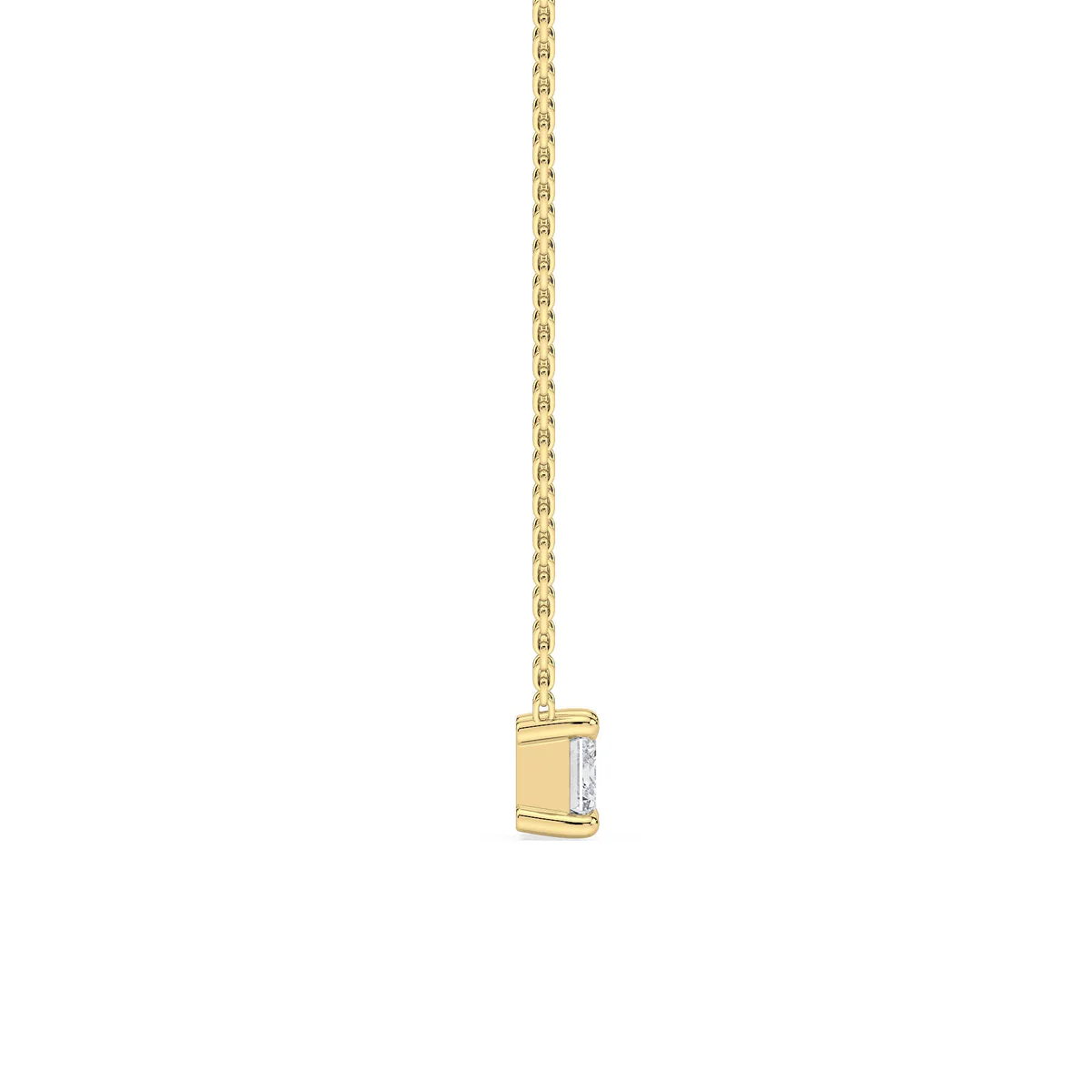 Side profile of custom emerald cut diamond necklace in gold highlighting setting and chain