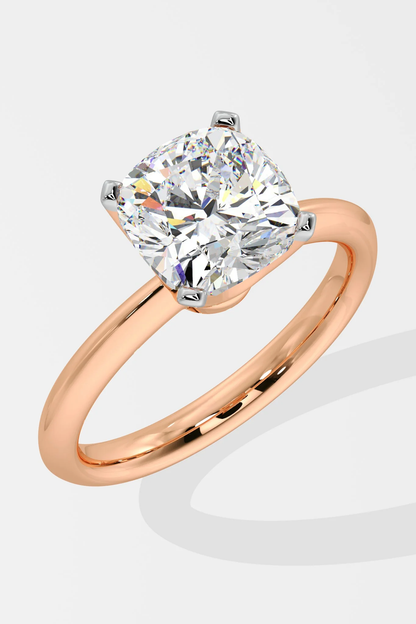 Rose gold ring with a large diamond on a white background