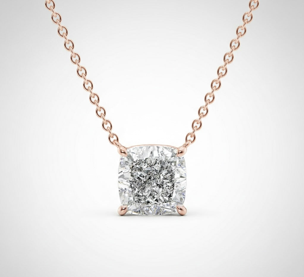 Cushion Cut Solitaire Diamond necklace with rose gold chain on a light gray background