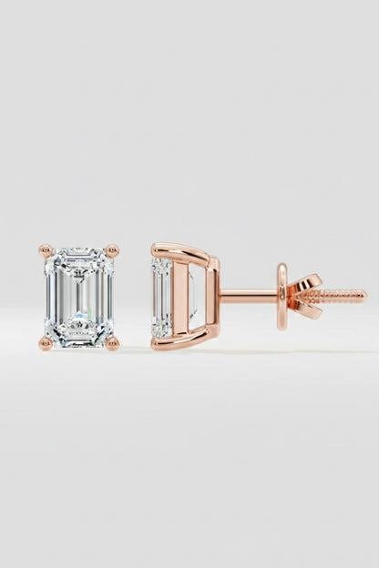 Rose gold emerald-cut diamond stud earrings on a light gray background