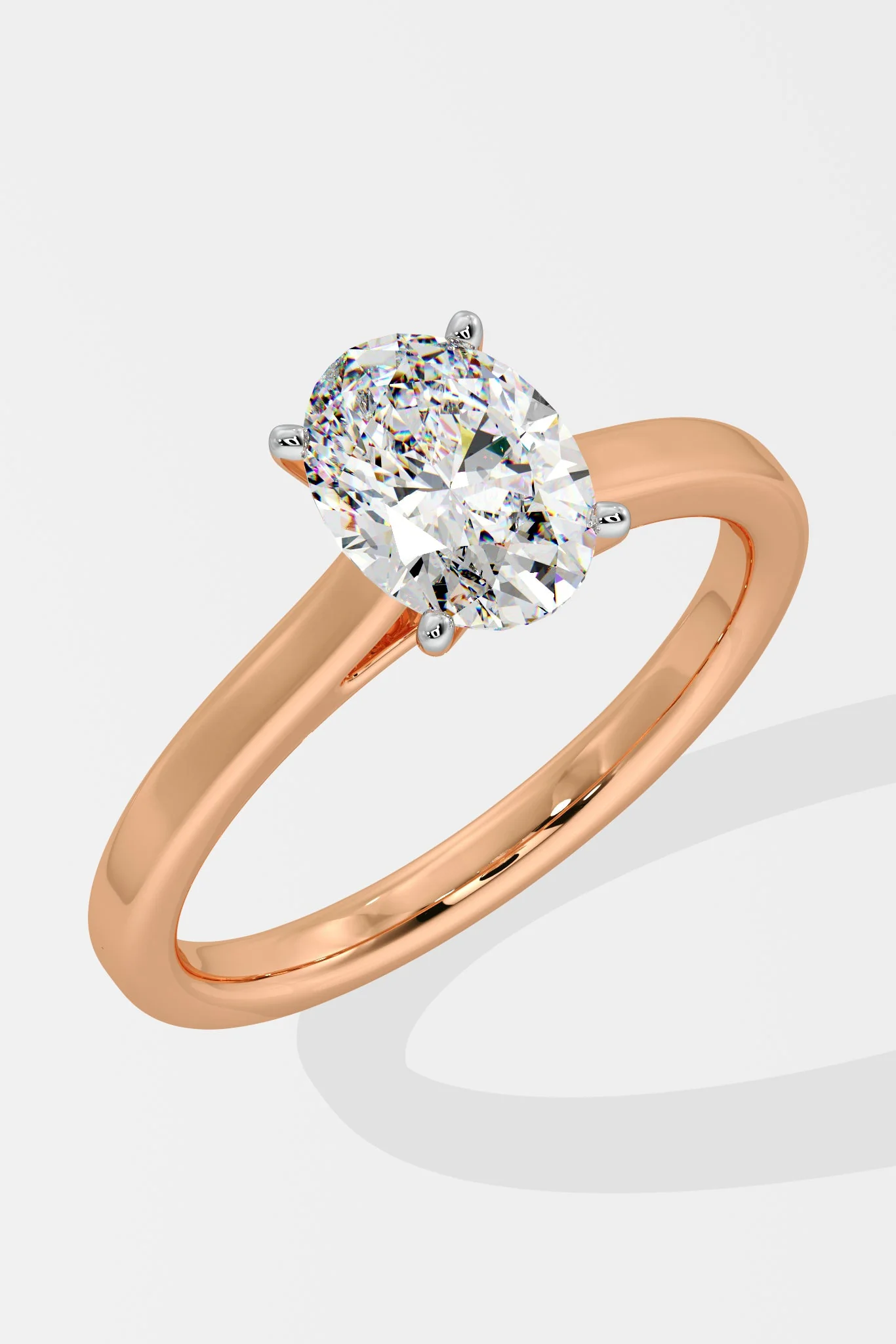 Rose gold ring with a diamond on a white background