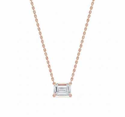 Rose gold necklace with a diamond pendant on a white background