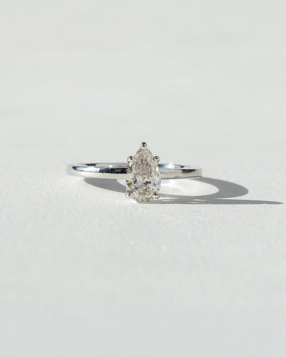 Diamond ring on a light gray background