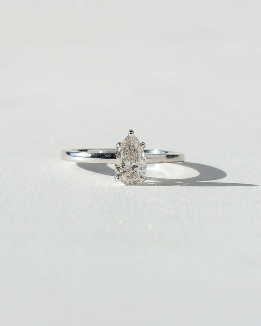 Diamond ring on a light gray background