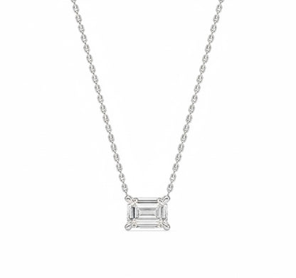Diamond necklace with emerald-cut pendant on a white background