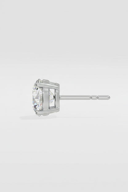 diamond stud earring on a light gray background