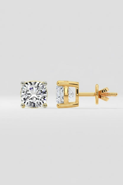 Gold stud earrings with Cushion cut diamond on a light gray background