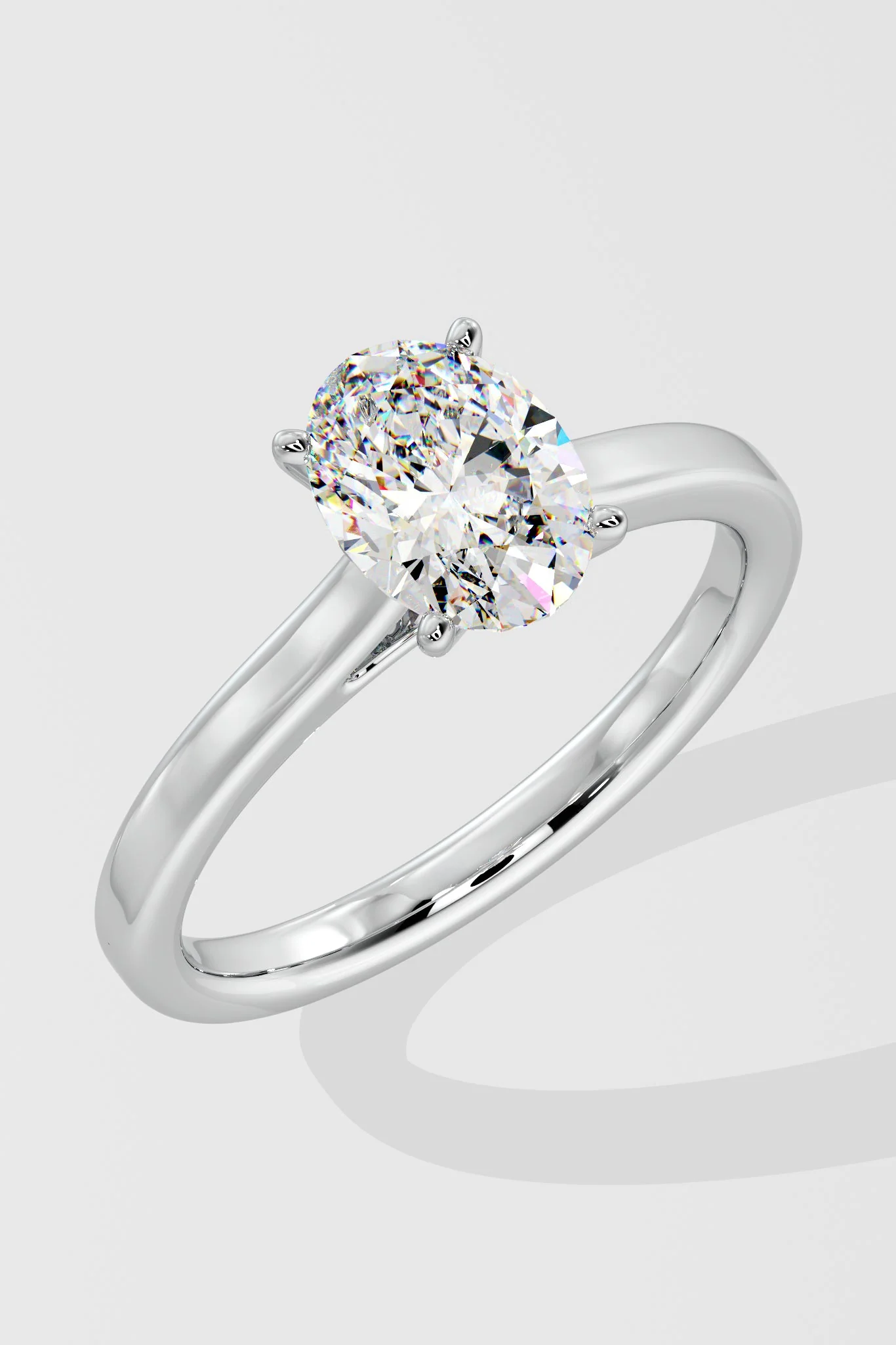 Close-up of oval cut lab-grown diamond (G Colour VS2 Clarity) and prong setting on solitaire ring