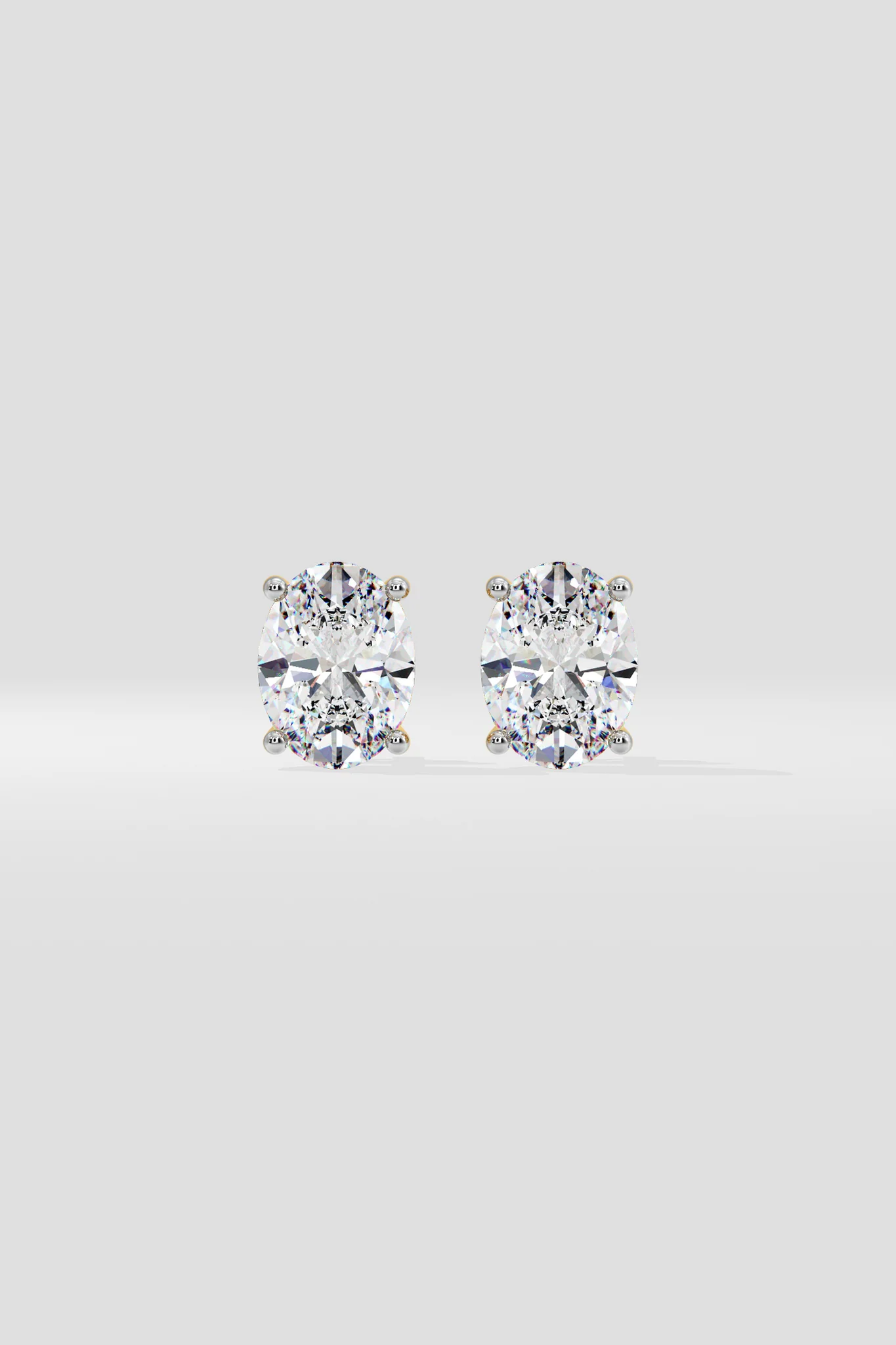 Front view of oval diamond stud earrings showing brilliant oval lab-grown diamonds