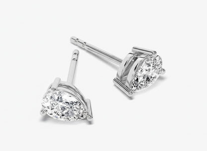 Pair of diamond stud earrings on a white background